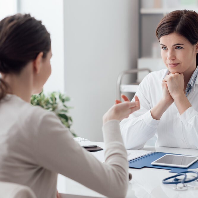 Doctor,Working,In,The,Office,And,Listening,To,The,Patient,
